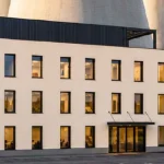 Milionová investice u atomové elektrárny. Nová budova vyroste přímo pod chladicími věžemi